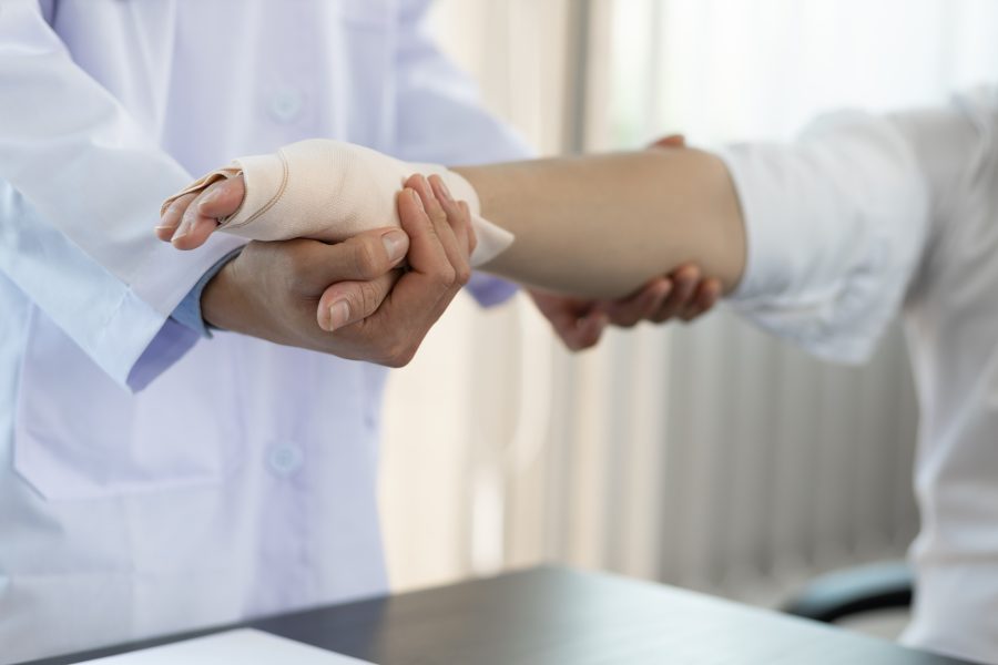 Medical professional treating wrist injury