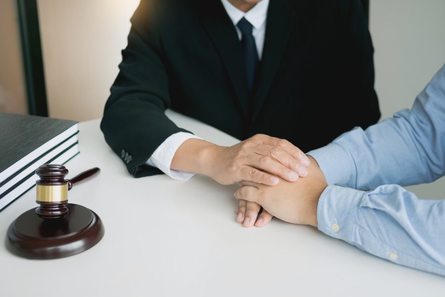 justice-and-law-concept-consultant-holding-client-2026-01-11-09-15-44-utc